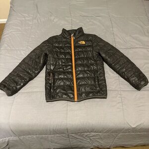 The North Face Black Puffer Jacket with Orange Zipper